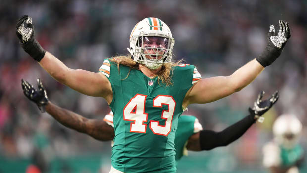 Miami Dolphins linebacker Andrew Van Ginkel (43) and linebacker David Long Jr., rear, celebrate a sack against the Dallas Cowboys during the first half of an NFL game at Hard Rock Stadium in Miami Gardens, Dec. 24, 2023.  